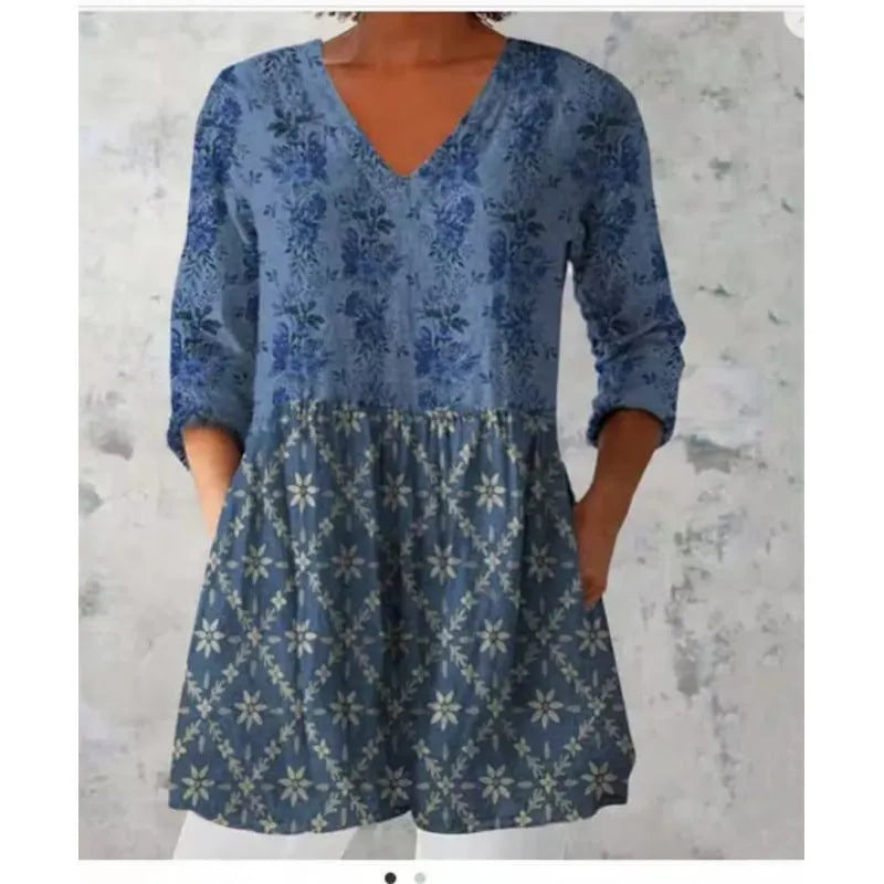 Women's printed loose dress with wide waist and 3/4 ruffle sleeves in a floral wave pattern.