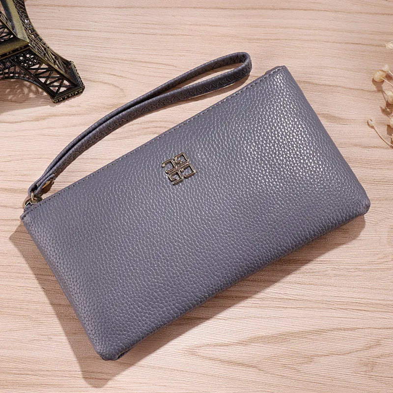 Long wine red crossbody phone wallet handbag with front zipper, shown with cards and phone in dedicated slots.