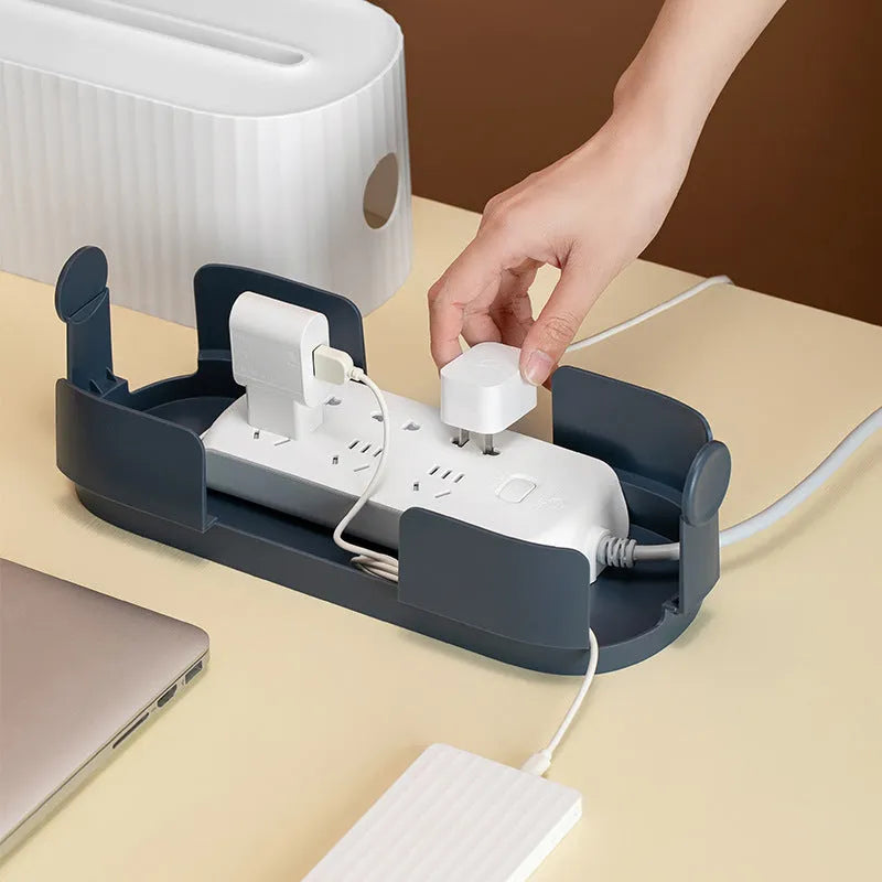 Blue and white power strip storage box with lid open showing cable management holes