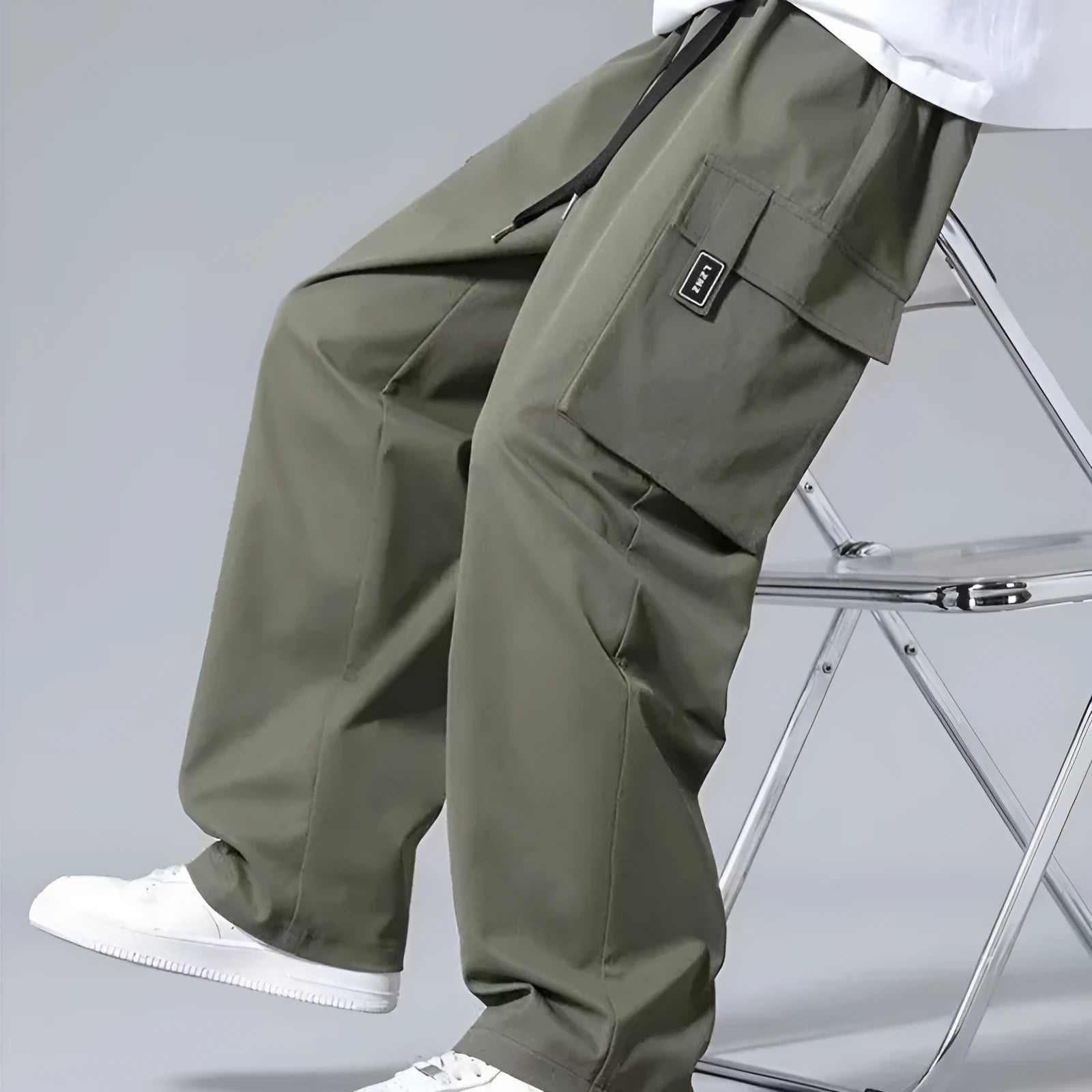 Boys' straight-leg cargo pants in army green with large pockets and a drawstring waistband.