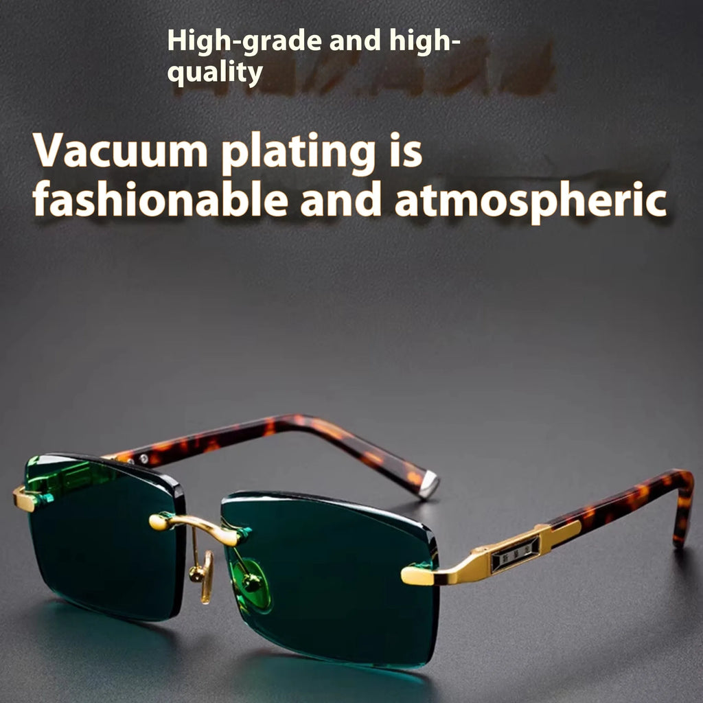 A pair of frameless sunglasses with dark green crystal lenses, shown with a hard protective case and a microfibre cleaning cloth.