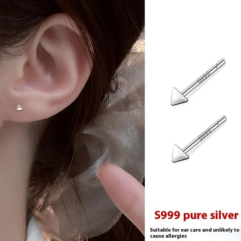 999 pure silver anti-blocking ear studs in butterfly shape on white background