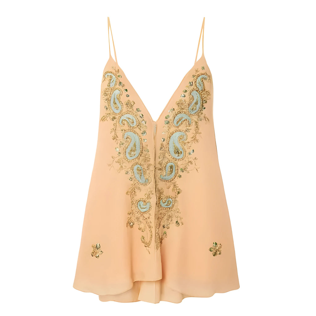 Light yellow women's sleeveless V-neck skirt with ethnic floral print, shown on a hanger.