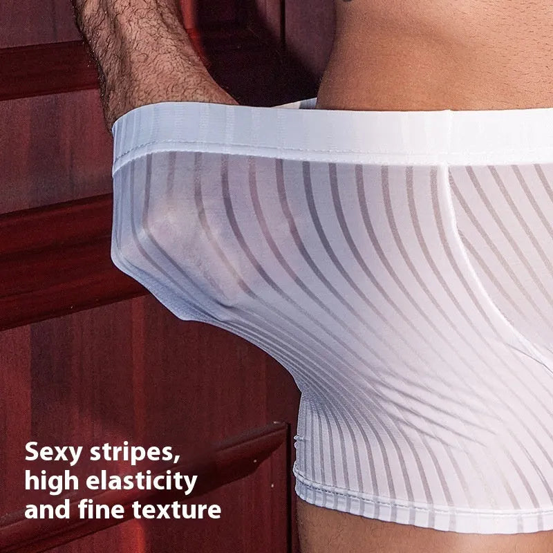 Man's black and white vertically striped boxer briefs laid flat, showcasing the free-size elastic waistband and leg openings.