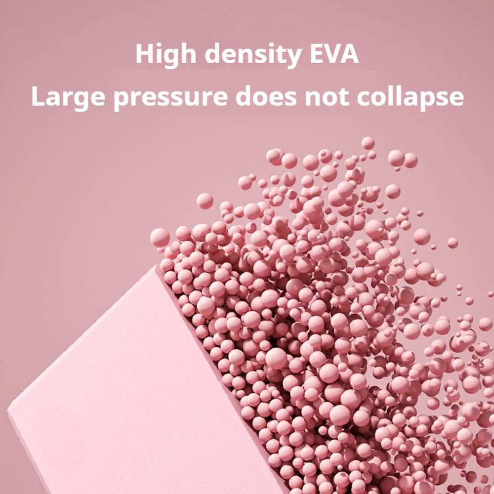 Solid colour high-density EVA yoga brick with hexagonal ridges on a gym floor.