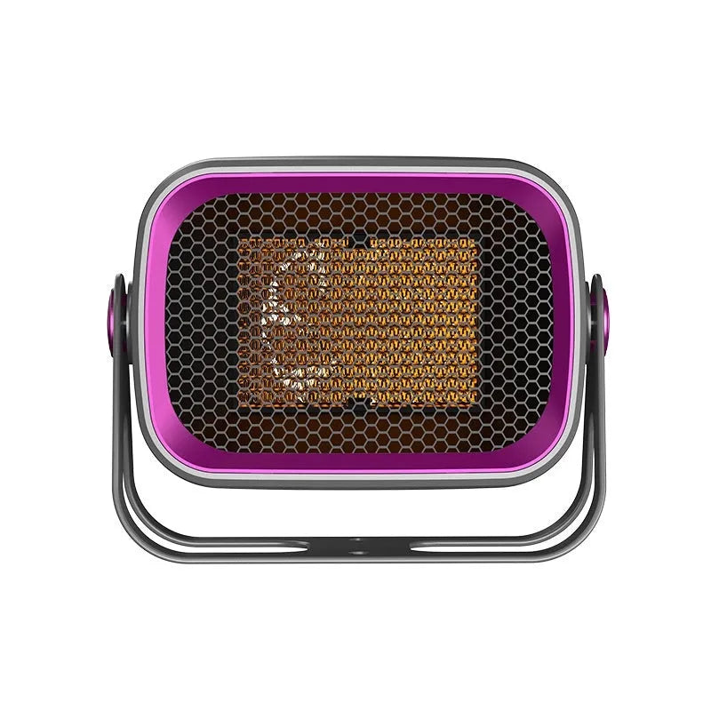 A compact grey desktop ceramic electric heater with a rotatable base on a wooden desk.