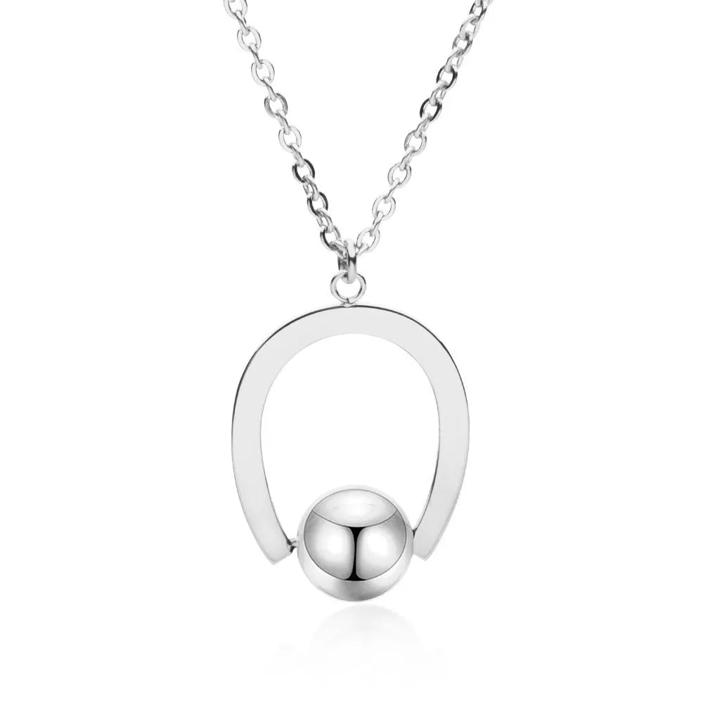 Gold or silver adjustable stainless steel necklace with a geometric pendant on a cross chain.