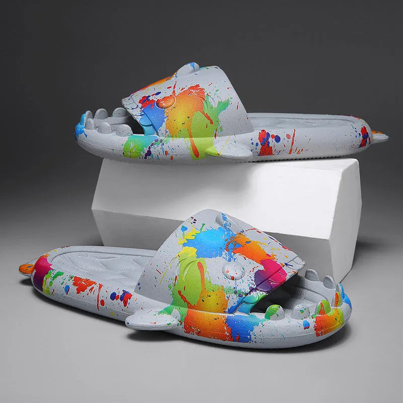 Pair of grey EVA foam open-toe slippers with a raised shark fin design on the front.