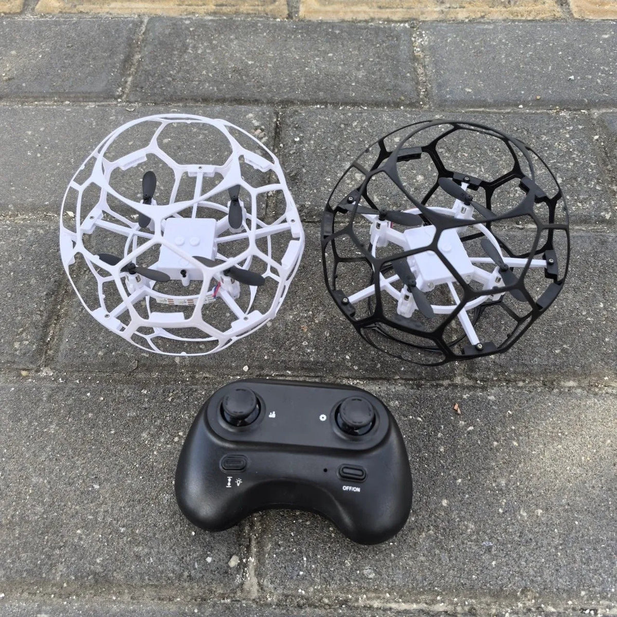 Hollow cup football UAV remote control education intelligent suspension toy in black plastic design