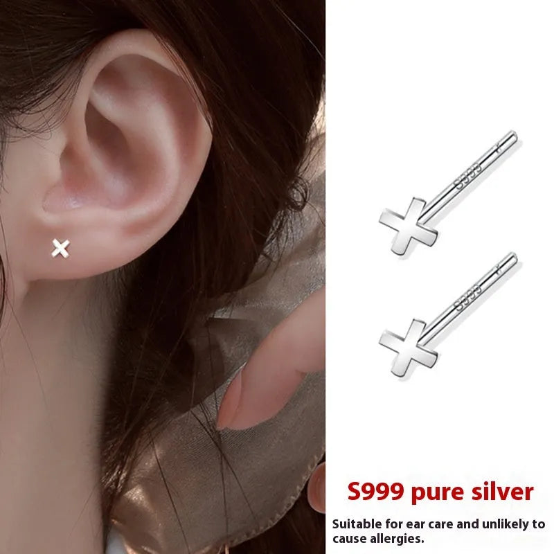 999 pure silver anti-blocking ear studs in butterfly shape on white background