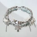 Silver zinc alloy star wings cross necklace on a clavicle chain with electroplated finish