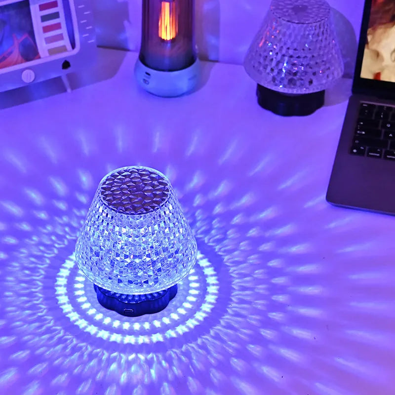 Crystal decorative table lamp with touch base on a nightstand, showing colour changing LED light.