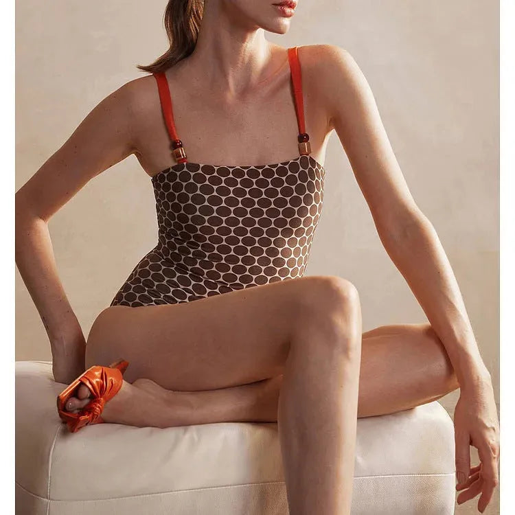 Women's one-piece swimsuit with matching wrap skirt in dot pattern design