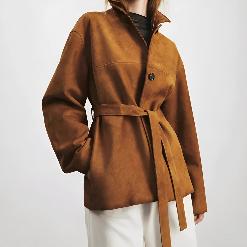 Yellow brown mid-length coat with Peter Pan collar and leather stitching on front.
