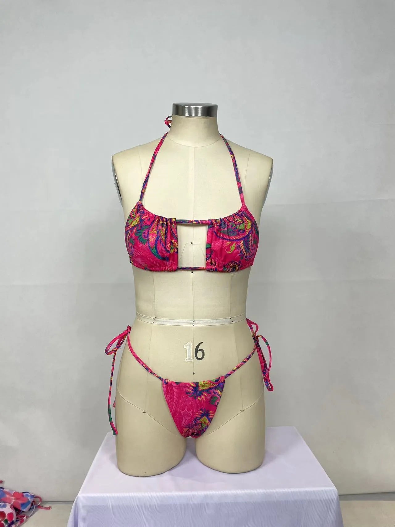 Pink printed women's bikini two-piece swimsuit set with sleeveless top and briefs