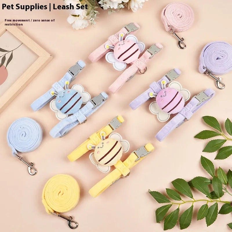Pink, yellow, and blue bee-shaped adjustable cat lead and rope set on a white background.