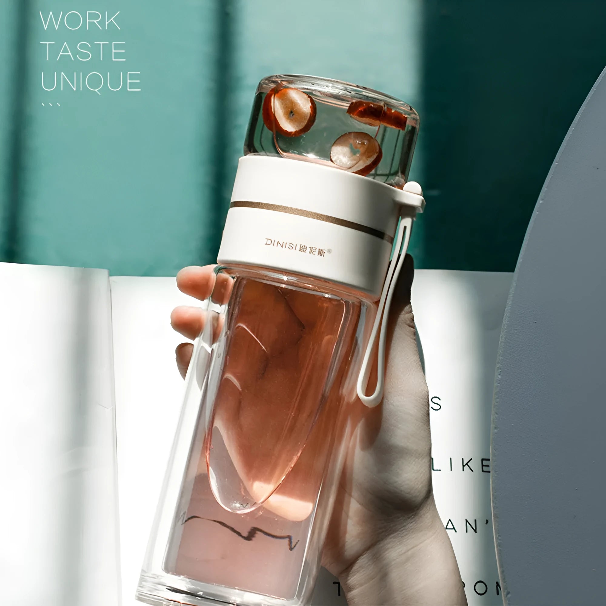 Glass water bottle with tea infuser filter showing double wall construction and portable rope