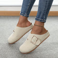 Women's brown closed toe canvas slippers with low top design showing pull-on style and textured canvas upper