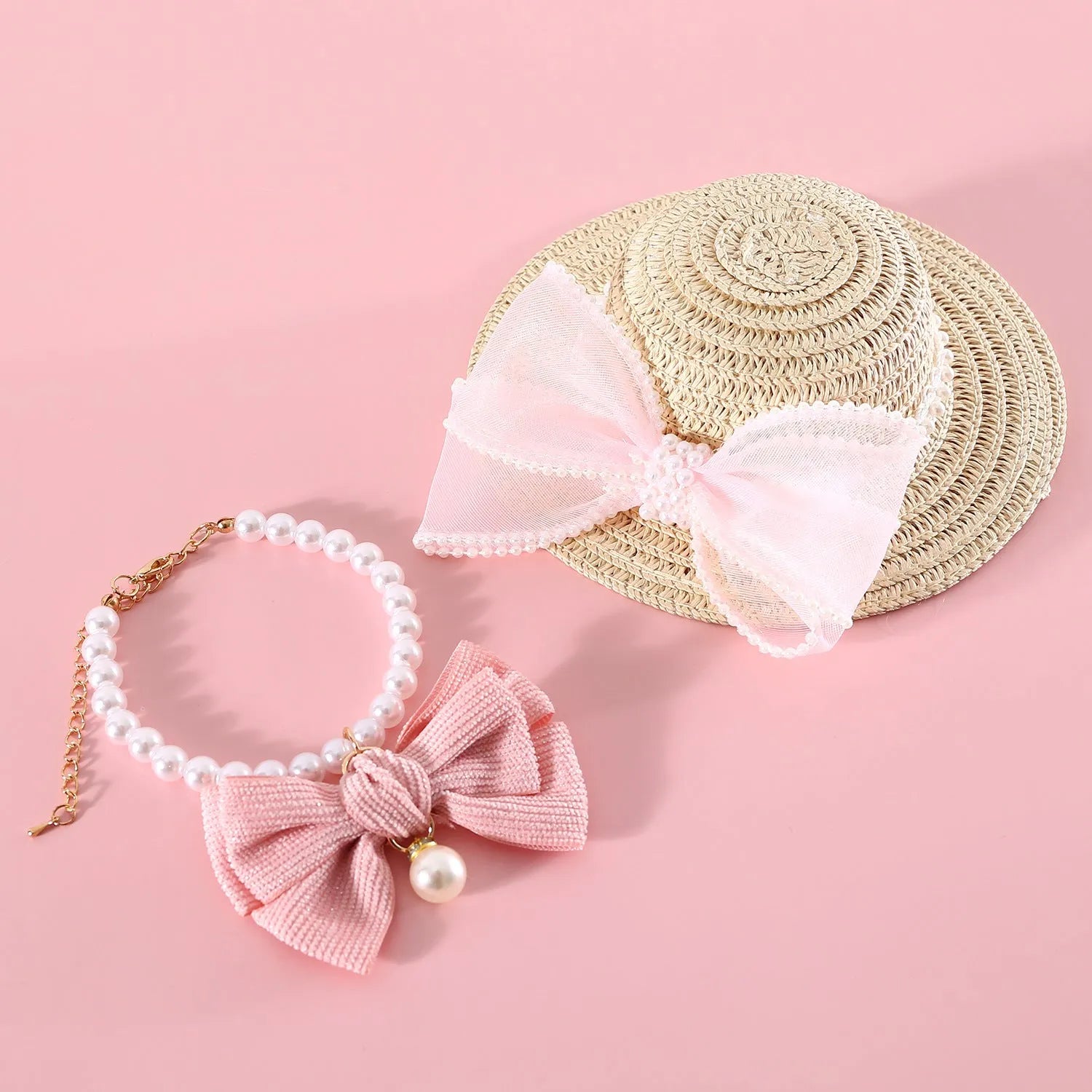 Cat wearing woven straw hat with pearl bow decoration in princess style