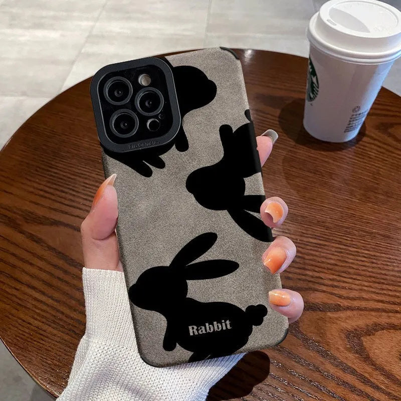 Cartoon creative TPU phone case with checkerboard bunny design on an iPhone 14, in wave black colour