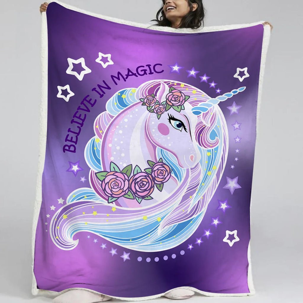 Purple unicorn themed sherpa fleece blanket with hemmed edges, available in 130x150cm and 150x200cm.