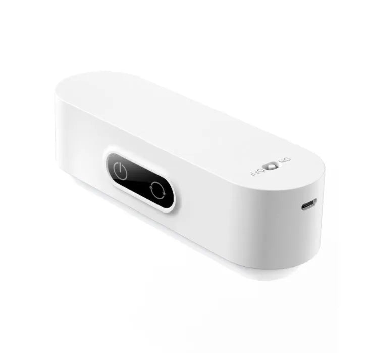 White magnetic USB rechargeable LED night light with touch controls mounted on a metal surface.
