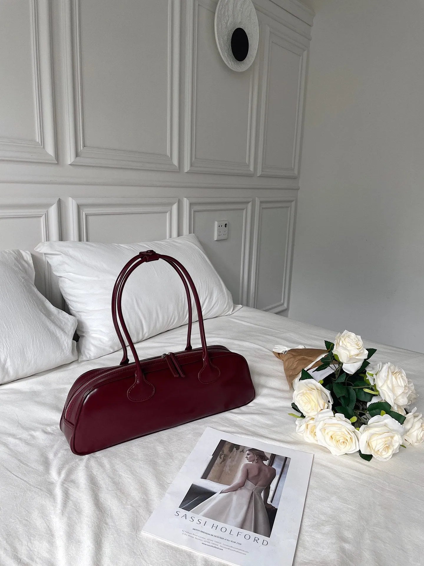 Retro genuine leather baguette bag in wine red with oval shape and sandwich pocket
