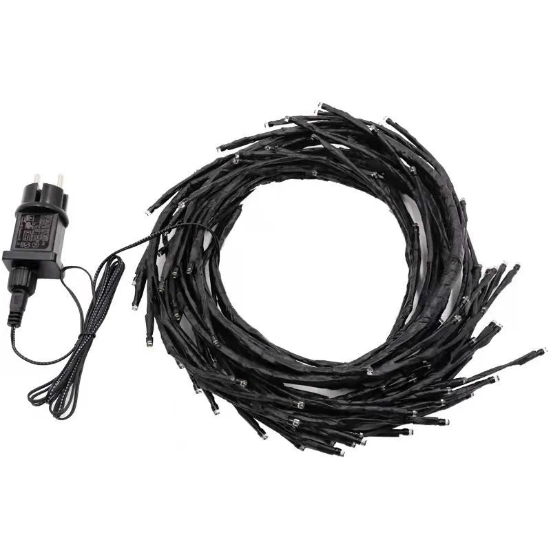 Flexible birch texture LED vine light garland with warm white lights draped along wall