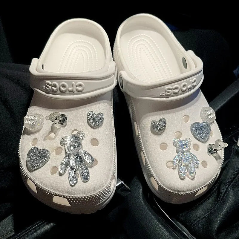 Crystal cloud bear shoe buckle set with resin, plush, and plastic details on a white background