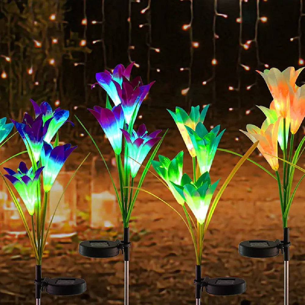 Solar lily flower garden light with purple or red flower head, ground stake, 70cm total height and IP65 waterproof rating