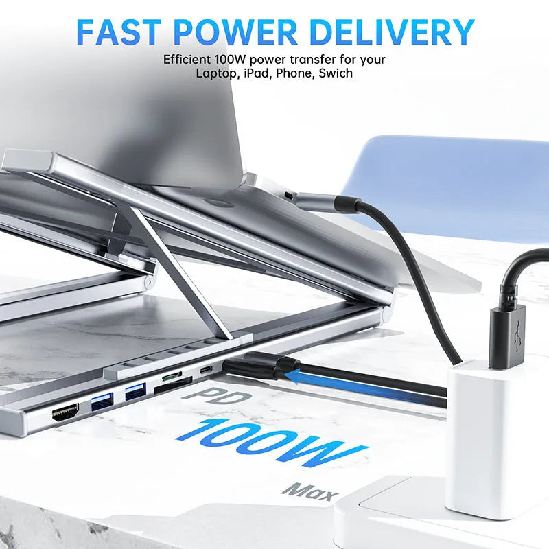 Folding aluminium laptop stand with integrated multi-port USB and HDMI docking station.