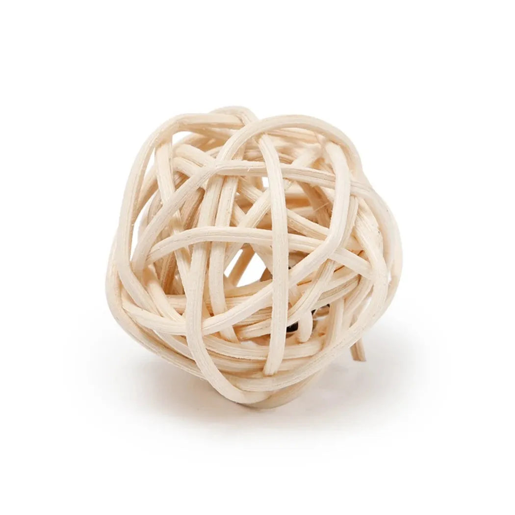 Primary colour cat toy set showing hollow rattan ball and faux feather bell ball on wooden floor