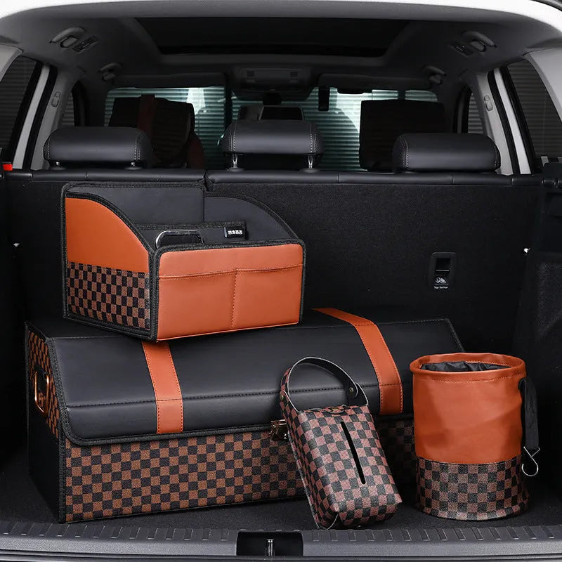 Brown leather retractable car trash can shown in a folded state with a carry handle.