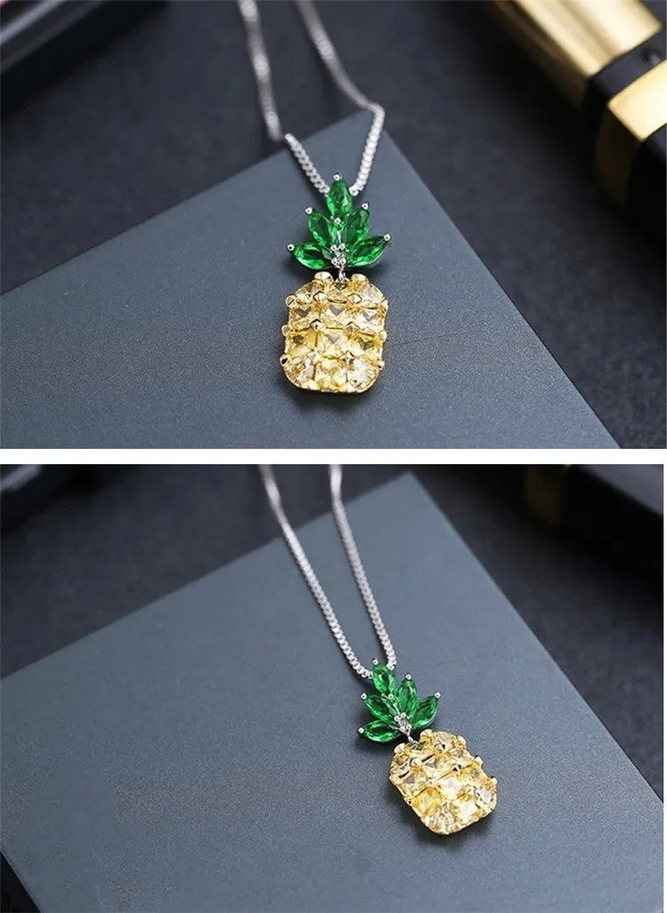 Silver plated women's necklace with a geometric pineapple pendant and diamond charm.