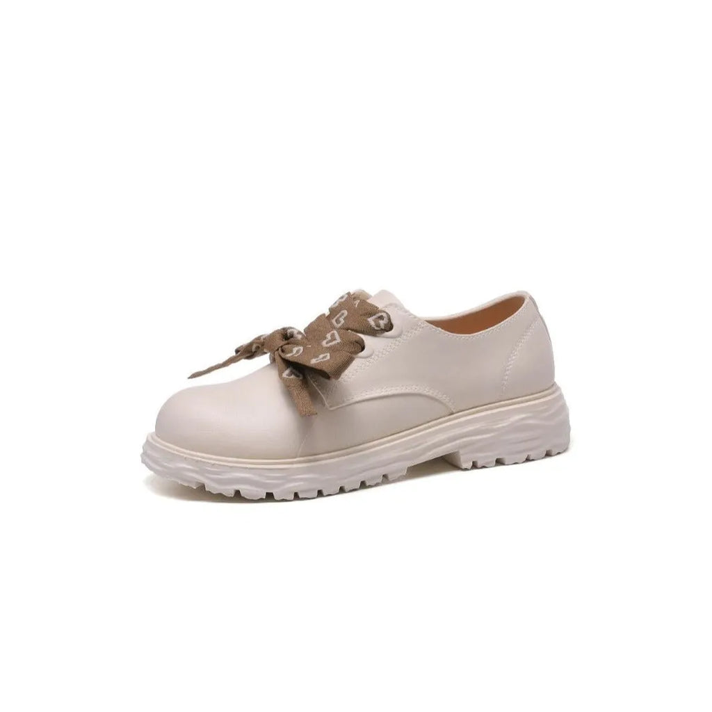 Women's mid-top rain boots with chunky low heel and round toe, available in ivory white, black, or khaki
