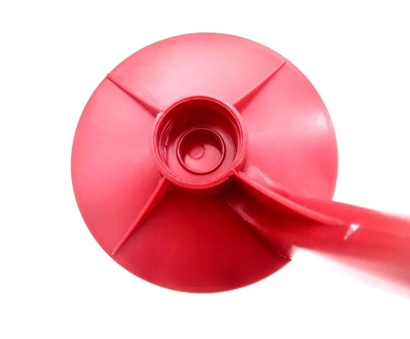 Red plastic Magic Tap soda drink dispenser attached to an inverted 2-litre bottle.