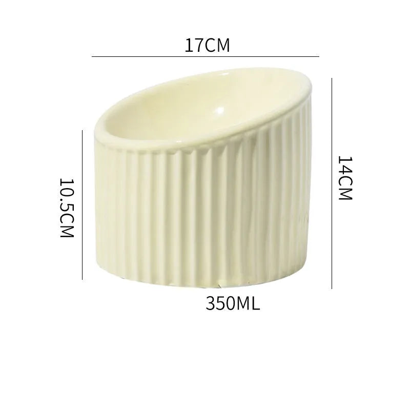 Elevated ceramic cat bowl in light green colour with tilted round design for comfortable feeding