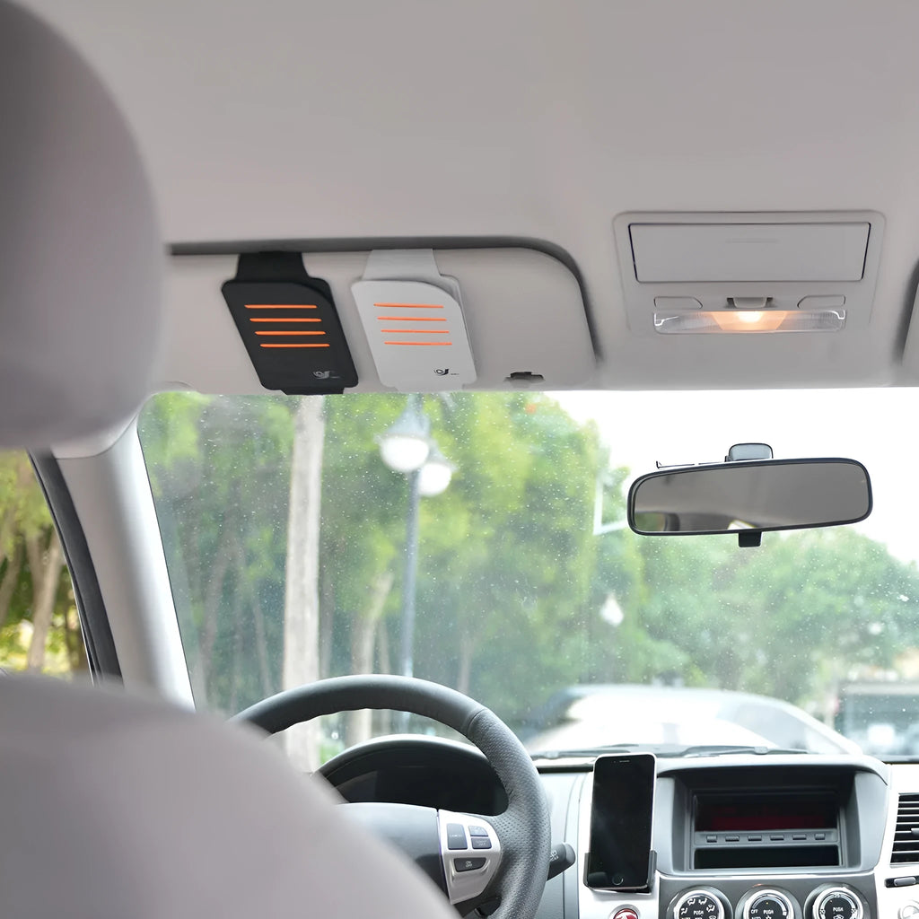 Car sun visor organiser shading panel in black or grey, holding sunglasses and cards.
