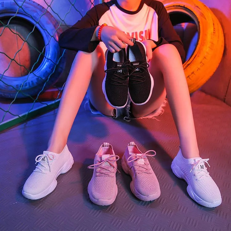 Women's white thick-soled casual shoes with woven upper and front strap.