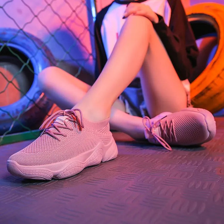 Women's white thick-soled casual shoes with woven upper and front strap.