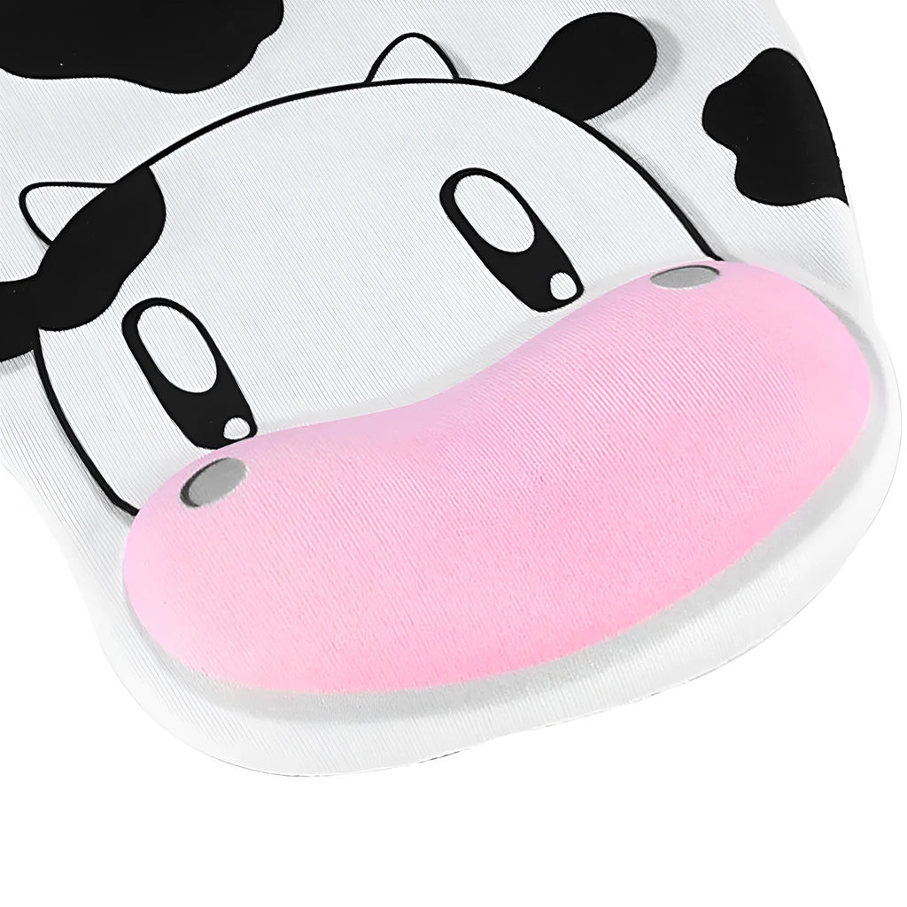 Super soft silicone cow pattern wrist rest mouse pad on a desk, showing non-slip base and ergonomic hand support.