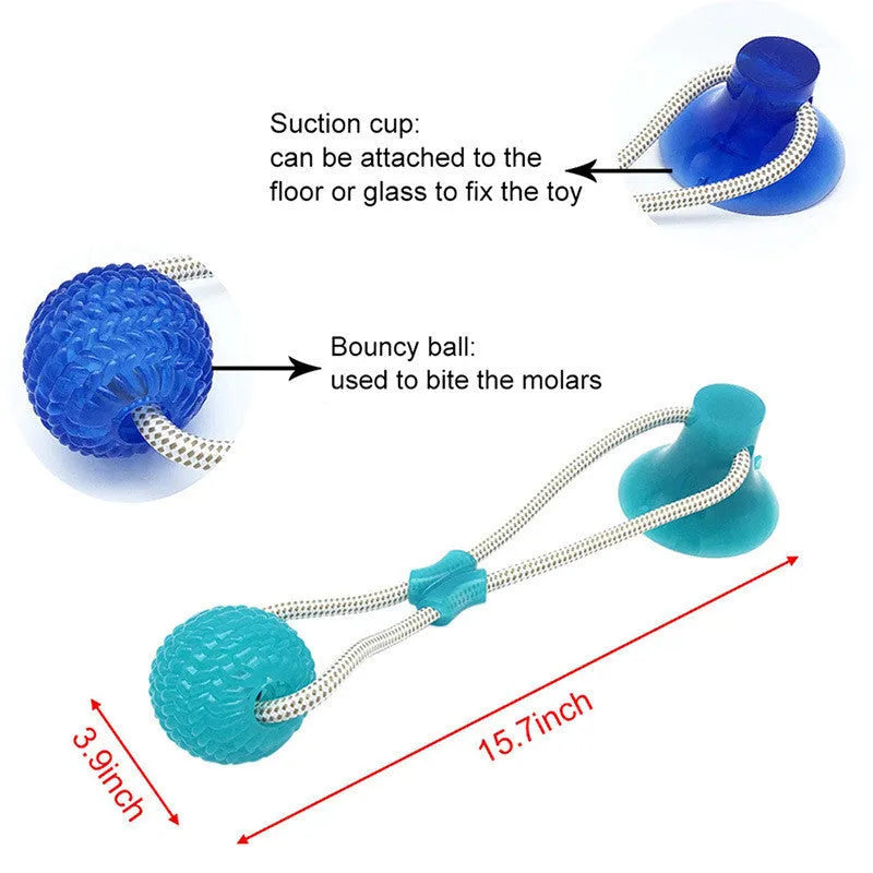 Pet dog rubber sucker molar toy in red colour on smooth surface