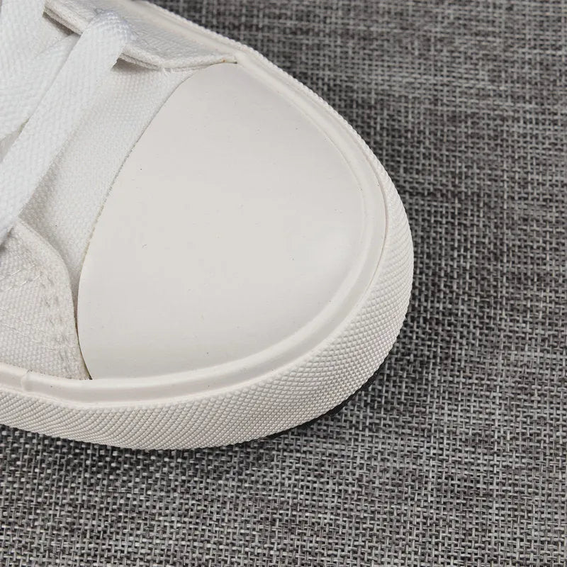 Velcro student canvas shoes high top with canvas upper, rubber vulcanised sole, round toe, and flat heel in black, grey or red and white.
