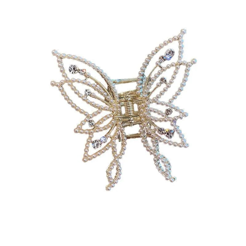 Butterfly-shaped alloy hair clip for women with rhinestone or pearl decoration.