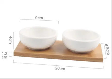 Porcelain ceramic dried fruit dish with compartments on wooden serving board