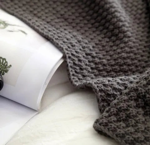 Nordic-style fringed knit acrylic blanket in beige, measuring 130 by 170 centimetres.