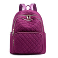 Women nylon embossed casual backpack in blue with zippered closure and soft handle