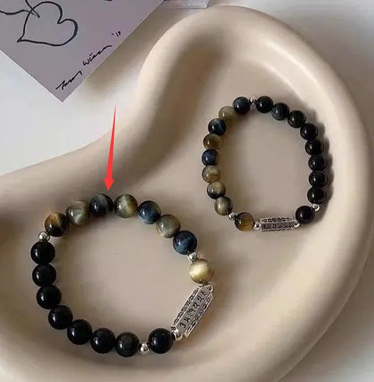 Tigereye Obsidian and sterling silver couple's bracelet with geometric beads and mantra inscription.