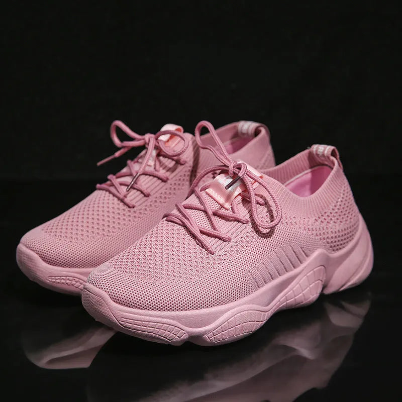 Women's white thick-soled casual shoes with woven upper and front strap.