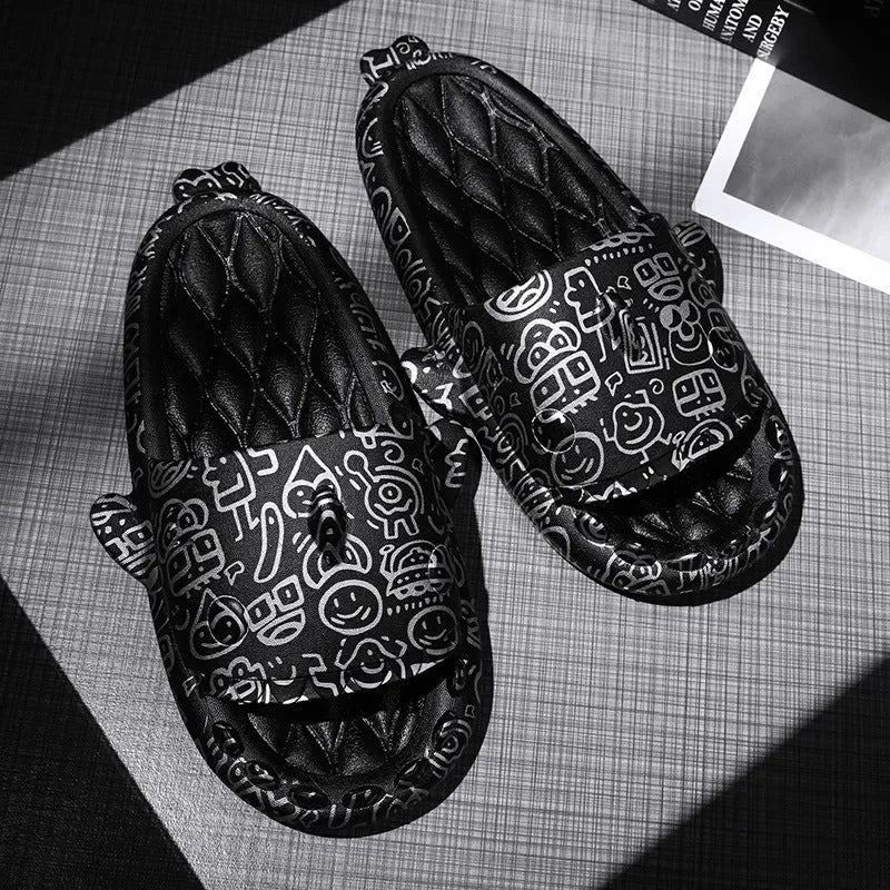 Pair of grey EVA foam open-toe slippers with a raised shark fin design on the front.
